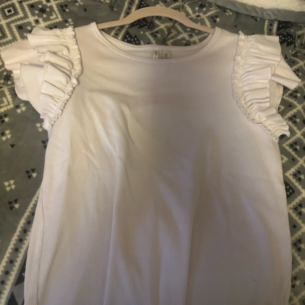 White xs Cato top and black and white plaid xs pants. Worn once